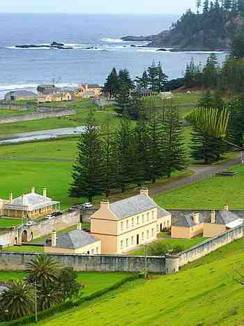 Foreground: Old Military Barracks in Norfolk Island today